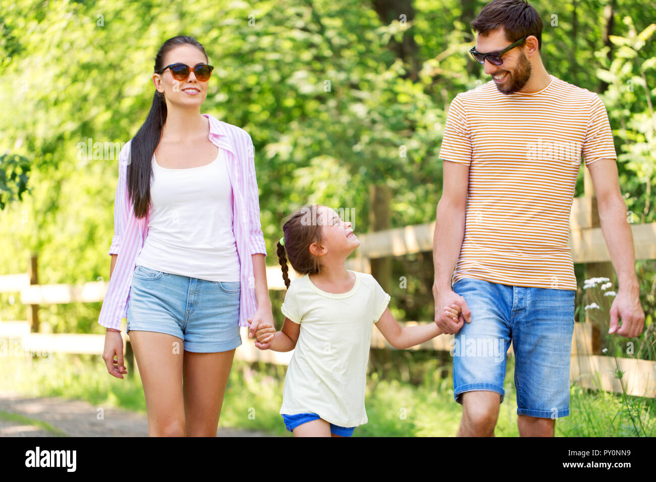 happy family walking in summer park Stock Photo - Alamy