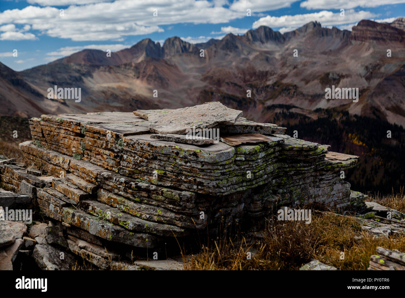 Sediments of various ancient environments take millions of years to lithify into the stratified layers we see in the rocky mountains. Stock Photo