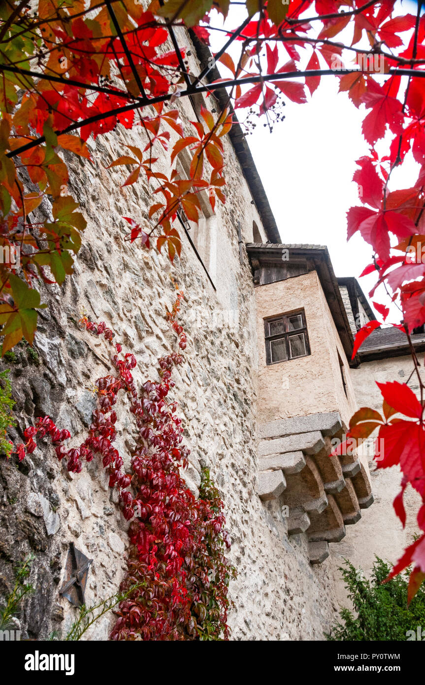 Looking up at a part of Castello di Tures/Burg Taufers through autumn leaves, Campo Tures/Sand in Taufers, Italy Stock Photo