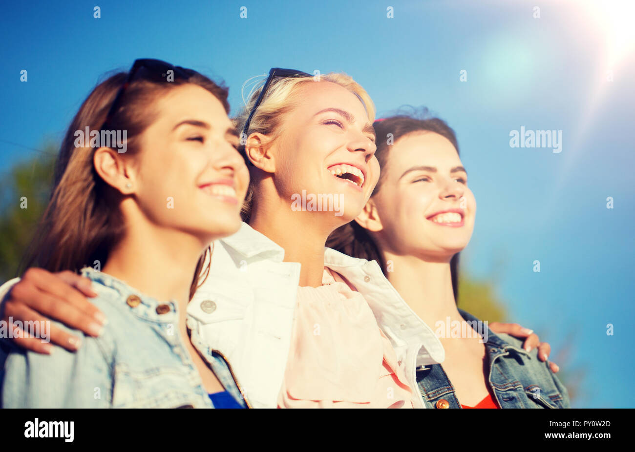 happy women or teenage girls hugging outdoors Stock Photo - Alamy