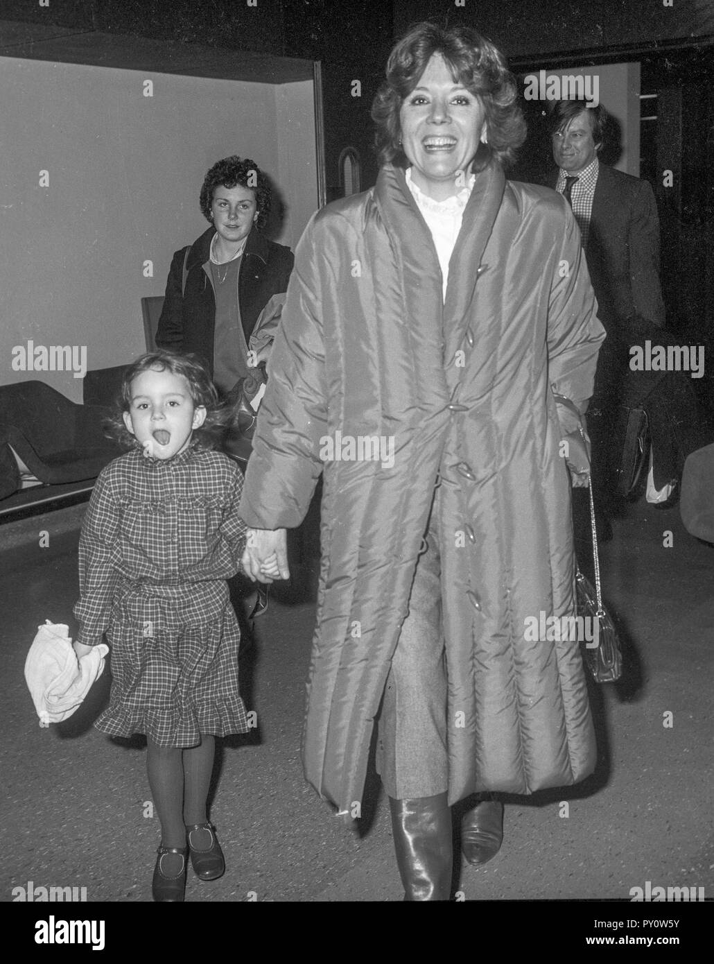 Actress Diana Rigg arriving at Heathrow Airport with daughter Rachael ...