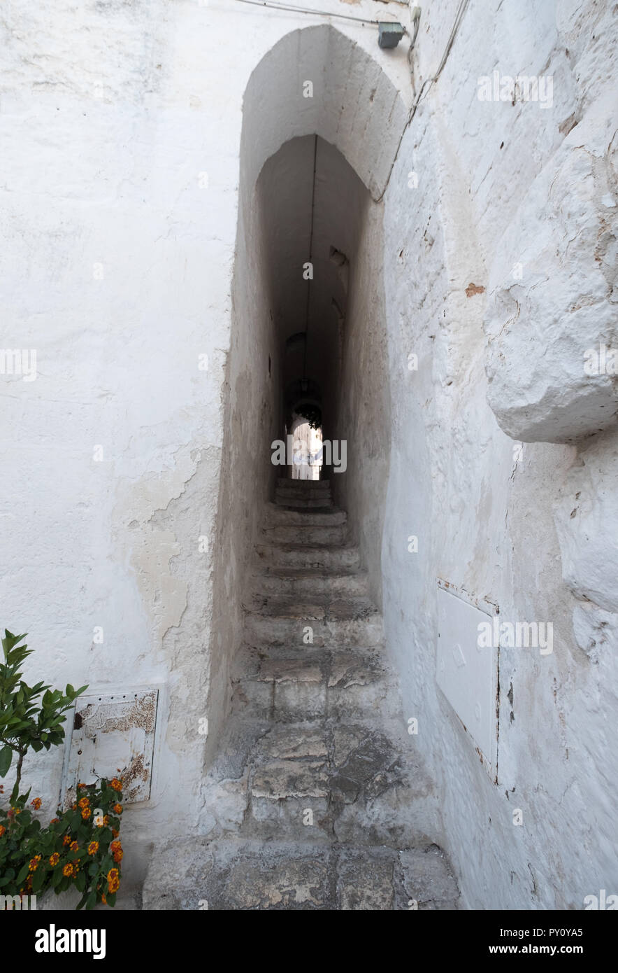 Ostuni Italy. White washed buildings on a stepped street in Ostuni in Puglia, Southern Italy. Stock Photo
