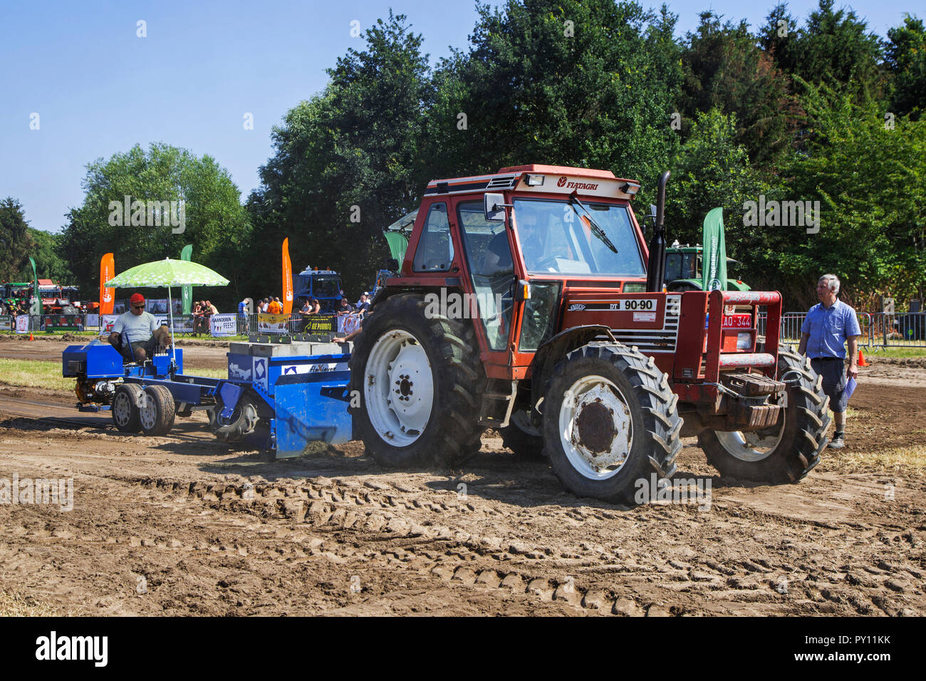 Non-modified tractor Fiat / Fiatagri 90-90 DT pulling heavy sled at Trekkertrek, tractor pulling competition in Zevergem, Flanders, Belgium Stock Photo