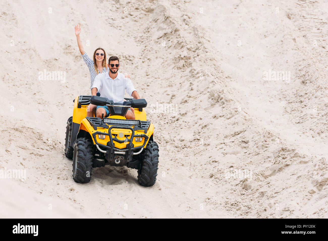 Woman waving in desert hi-res stock photography and images - Alamy