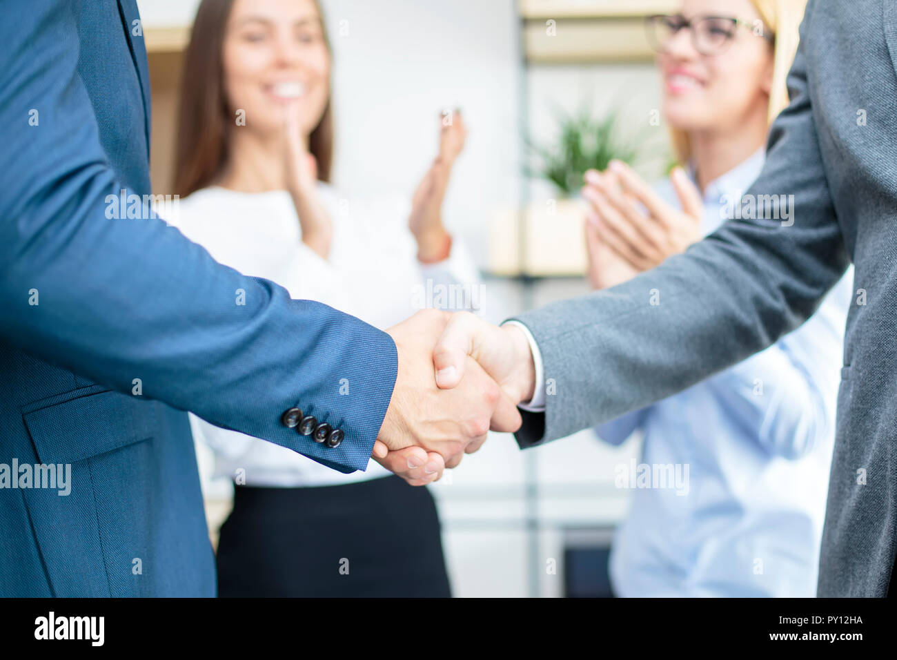 Closeup of a businessmen handshake when finishing up a meeting Stock ...