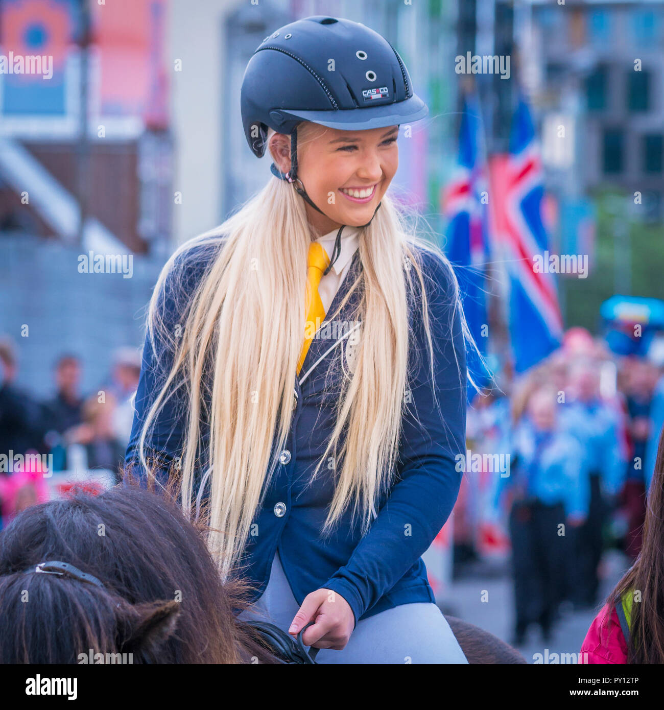 Young girl on horseback, during Iceland's independence day, Reykjavik, Iceland Stock Photo