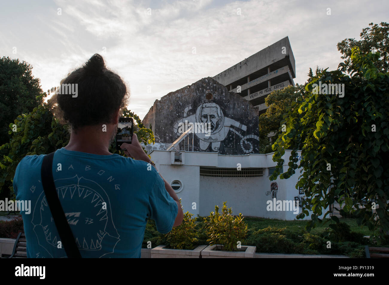 Mostar: view of the Staklena Banka, a building used by Bosnian War snipers later transformed as the Staklena Banka Collection public art space Stock Photo