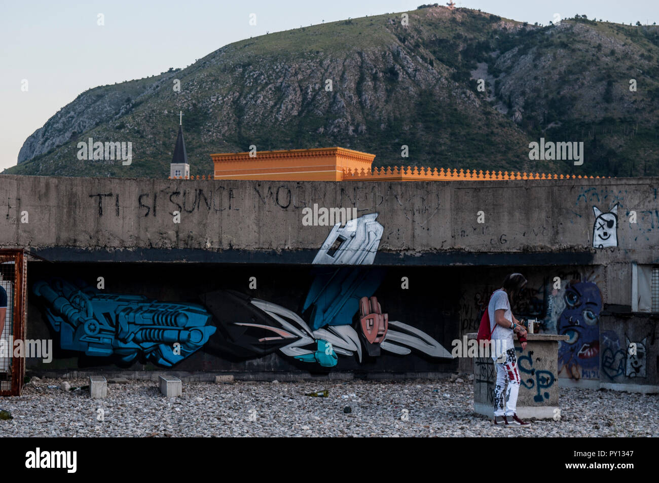 Mostar: mural around the Staklena Banka, a building used by Bosnian War snipers, later transformed as the Staklena Banka Collection public art space Stock Photo