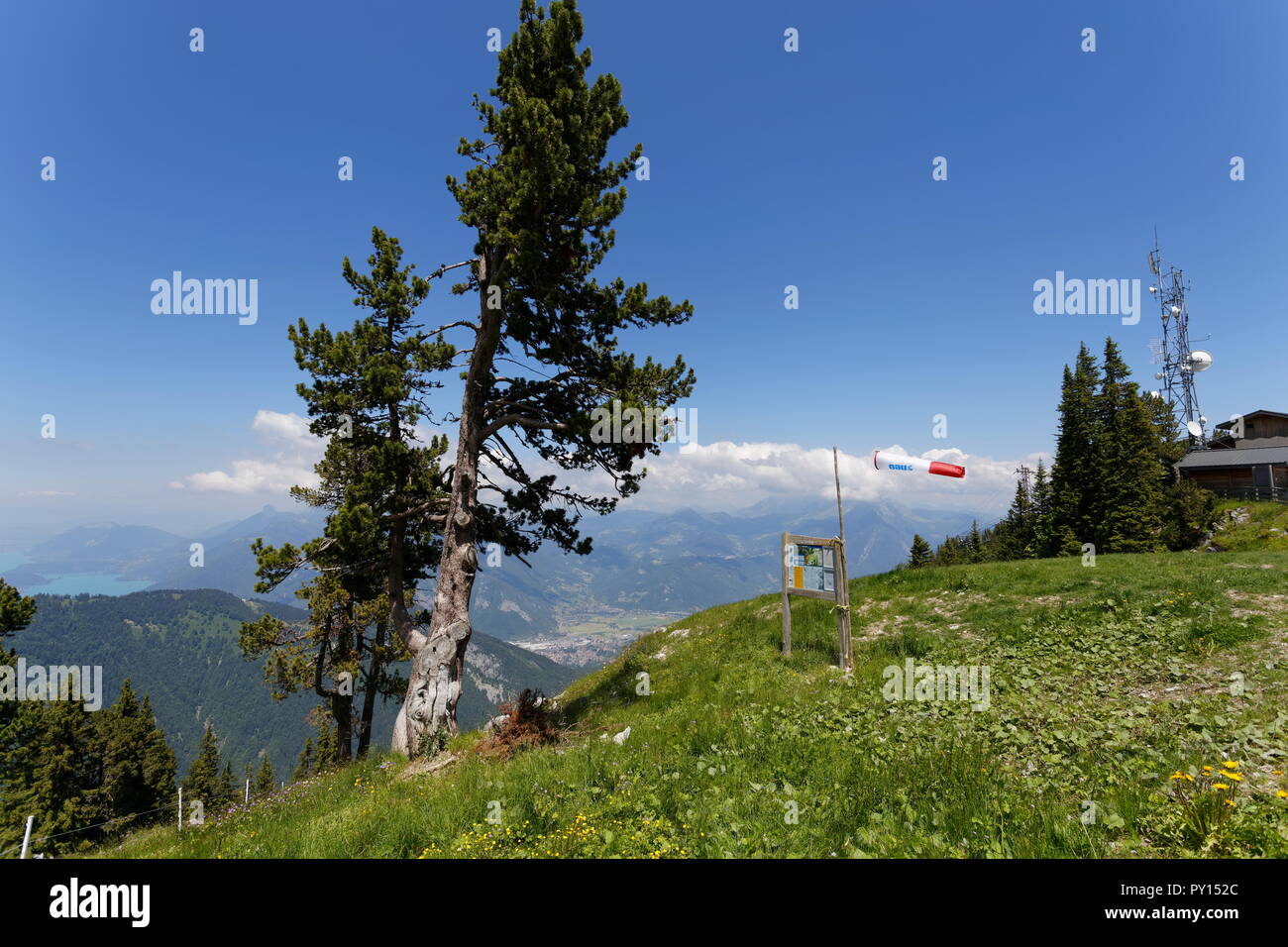 View from the top chairlift station with a wind sock and a distant view of Lake Annecy La Sambuy mountain area near Faverges France Stock Photo