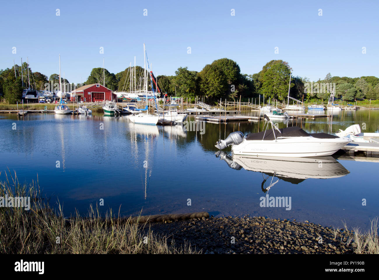 Scenic Pocasset River, Bourne, Cape Cod, Massachusetts with boats docked on a sunny blue sky morning Stock Photo