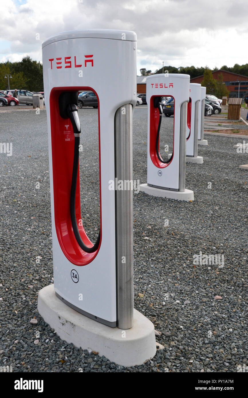 Tesla charging points for electric vehicles at Darts Farm, Exeter, Devon UK Stock Photo