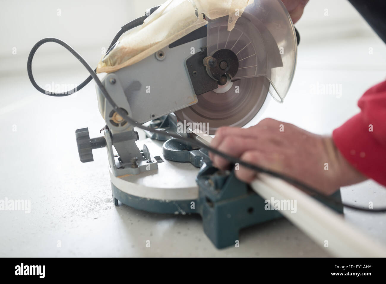 Laborer using a small electric circular 