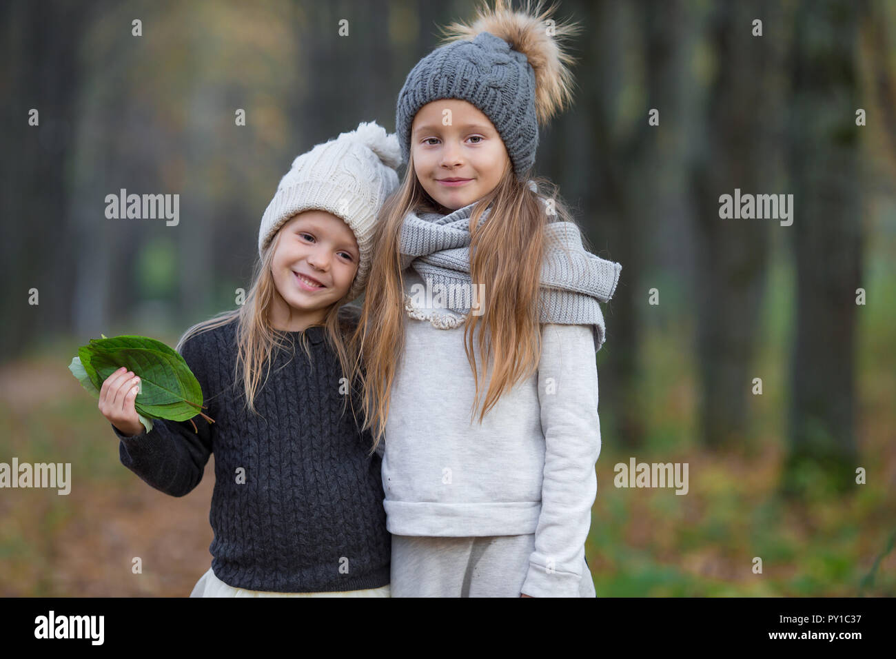 Adorable girls outdoors at warm sunny autumn day Stock Photo - Alamy