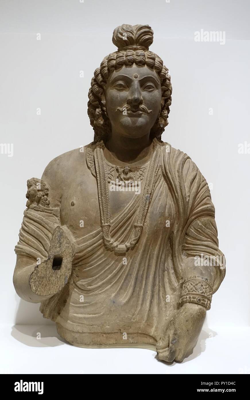Bust of a bodhisattva, Gandharan region, Pakistan, Kushan empire, 100s-200s AD, gray schist - Stock Photo