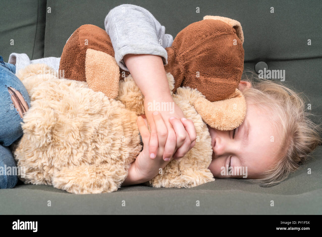 child sleeps with soft toys Stock Photo Alamy