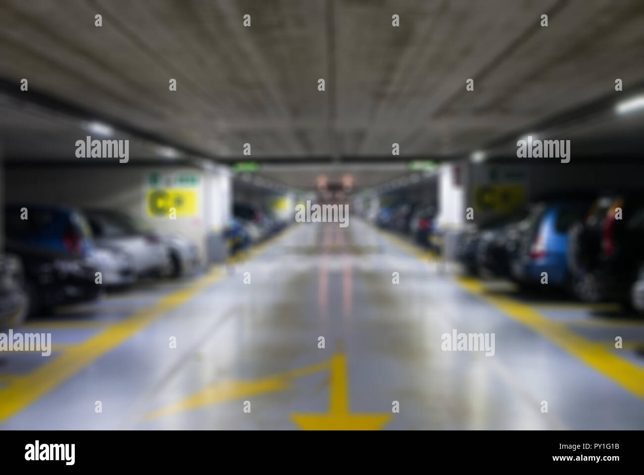 Blurred background of underground car parking garage Stock Photo