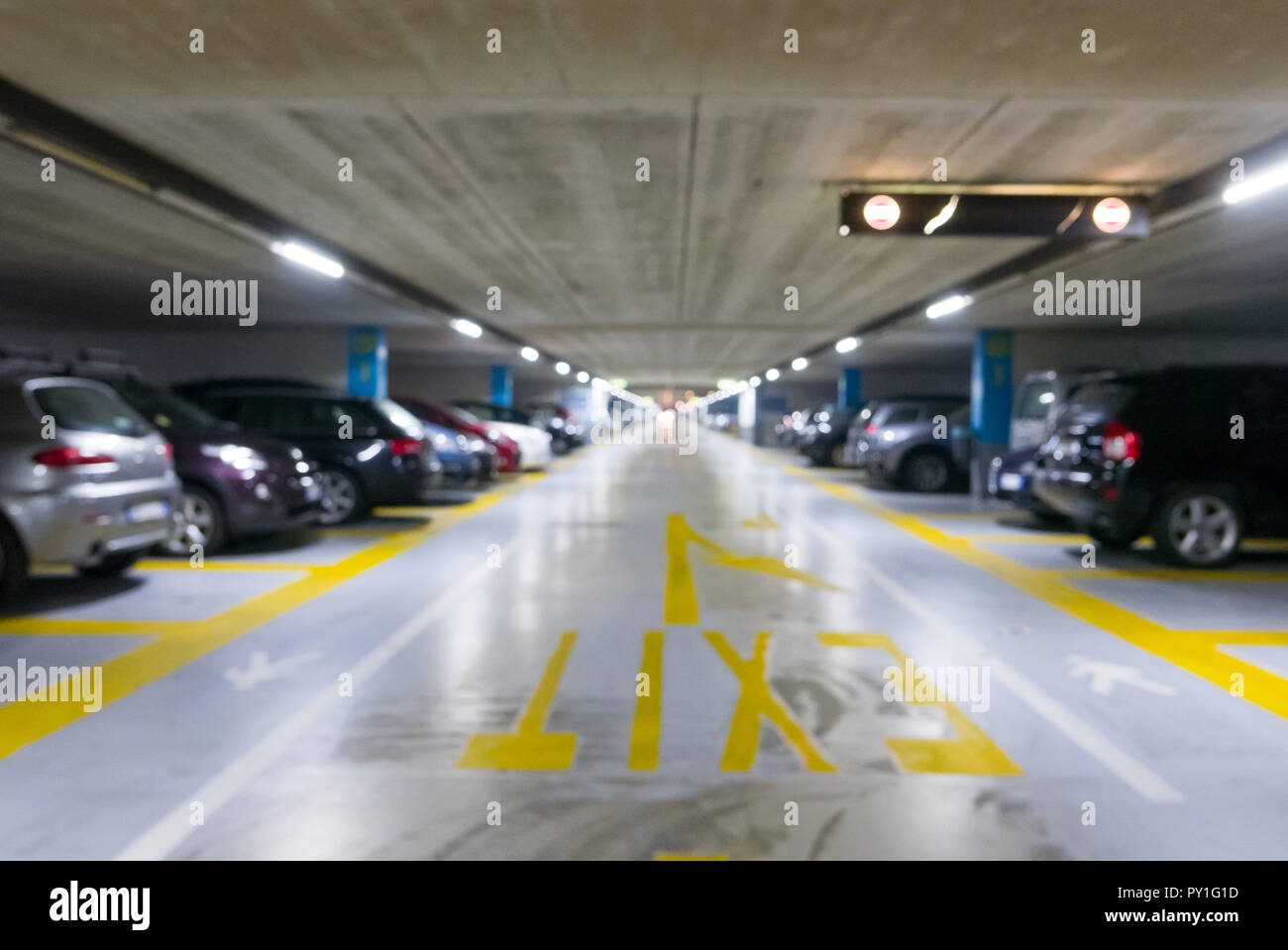 Blurred background of underground car parking garage Stock Photo