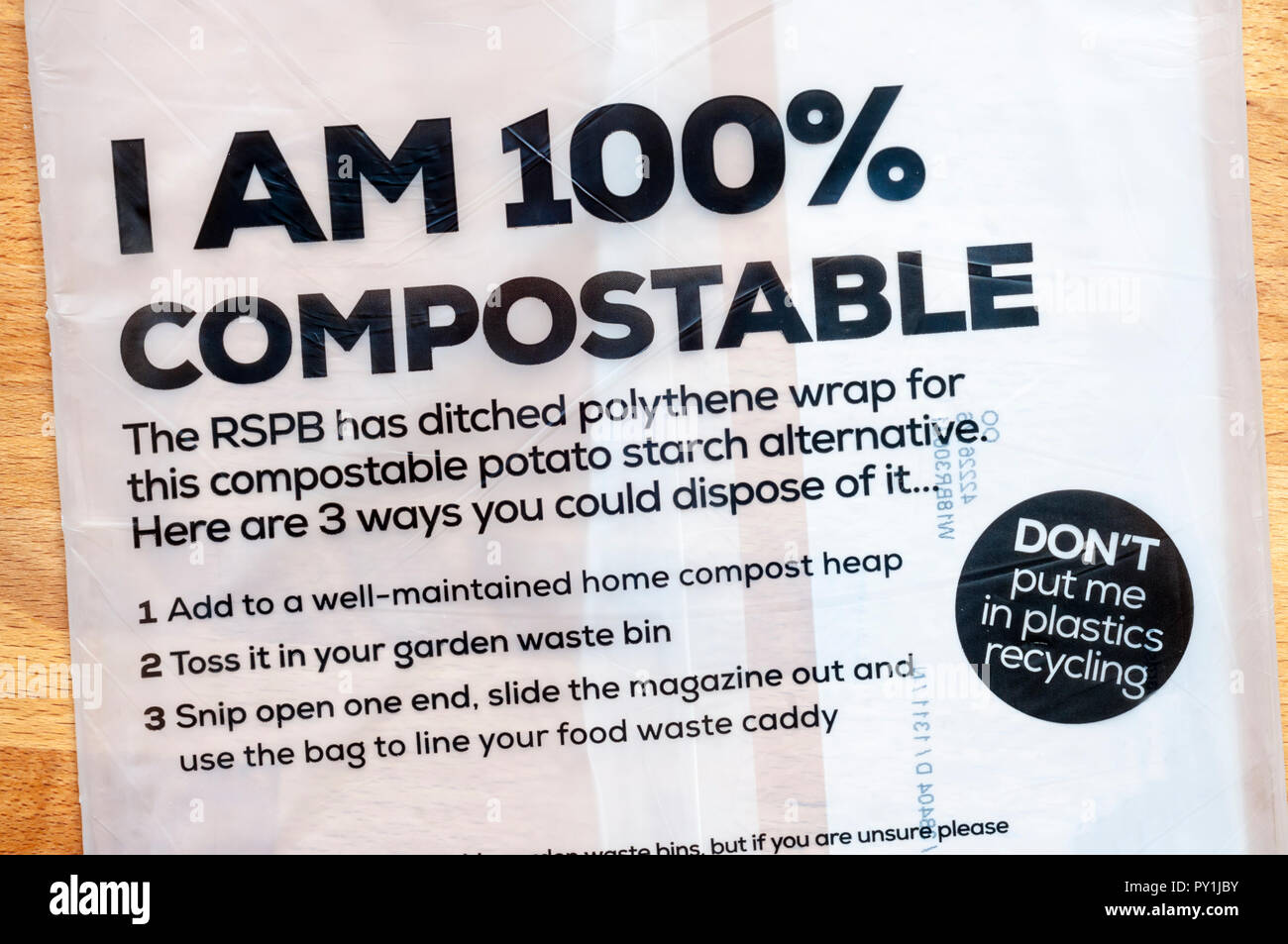 Biodegradable compostable bag for RSPB magazine.  Made from biodegradable potato starch. Stock Photo