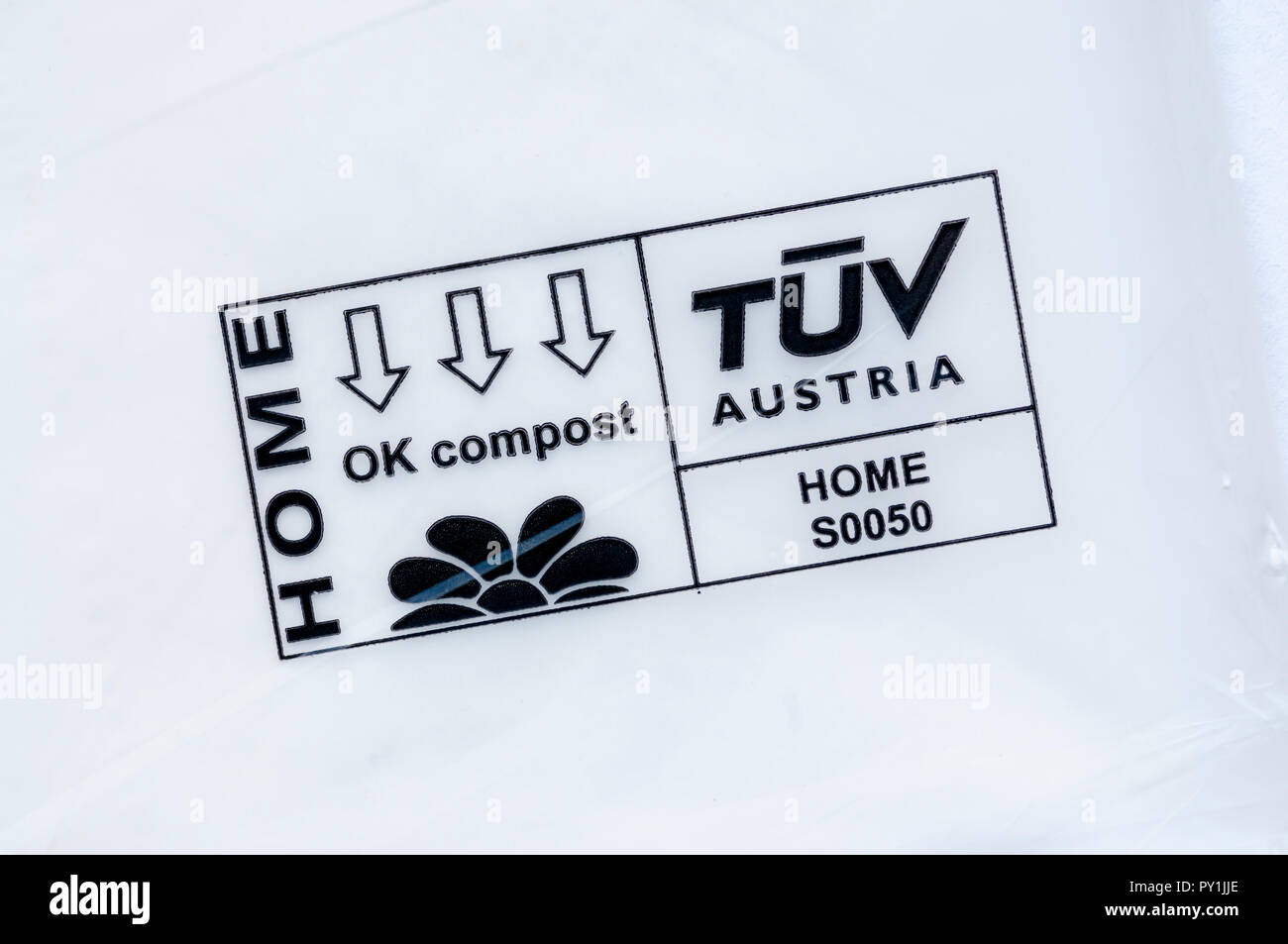 The TUV Austria OK Compost Home mark means that a bag will biodegrade at low temperatures on a home compost heap. Stock Photo