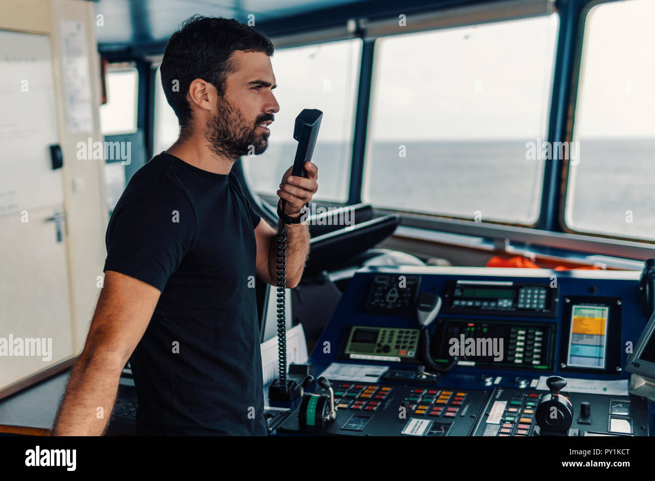 Marine navigational officer is reporting by VHF radio Stock Photo Alamy