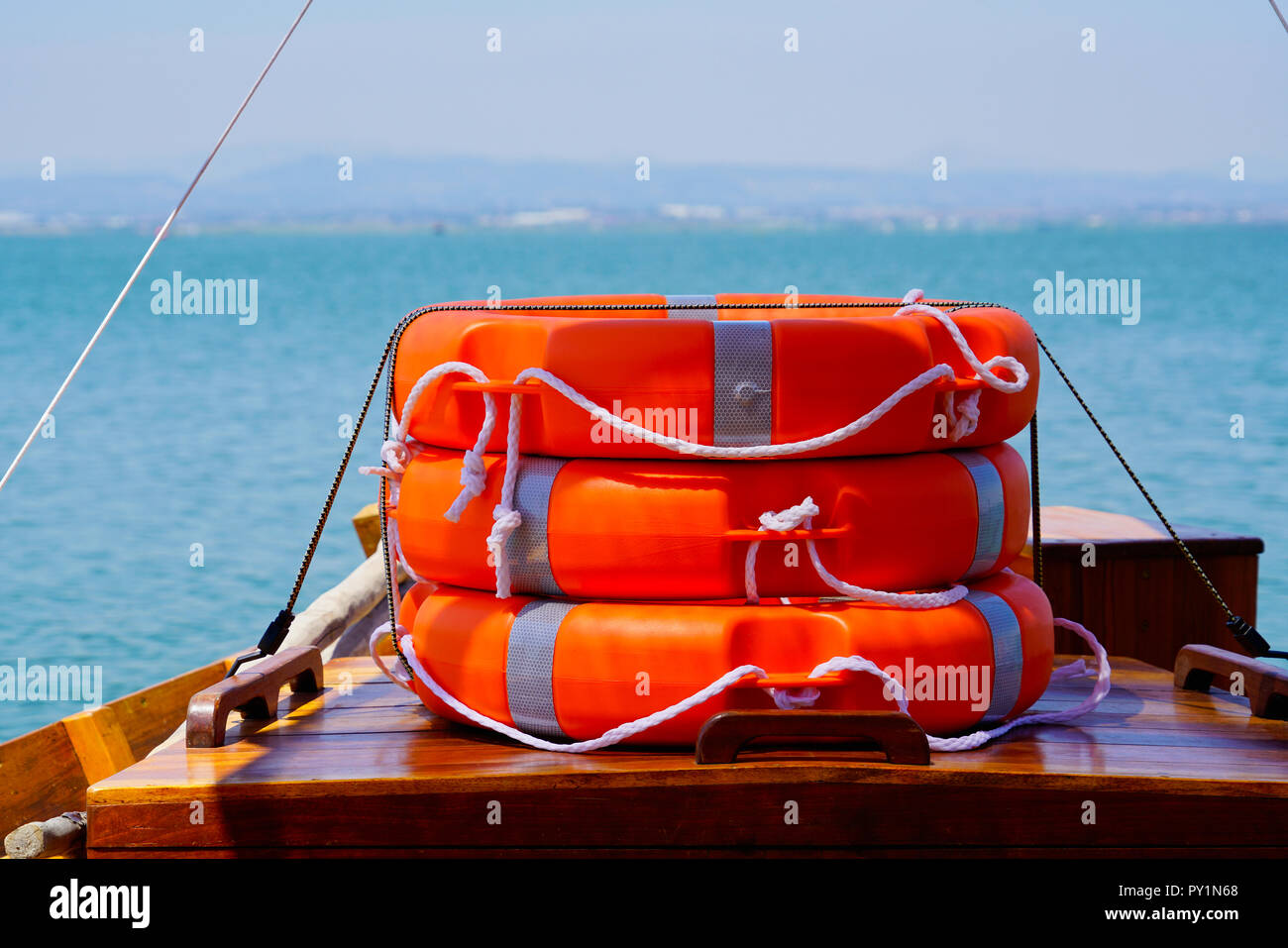 lifebelt - stack - on a boat w water in the background Stock Photo