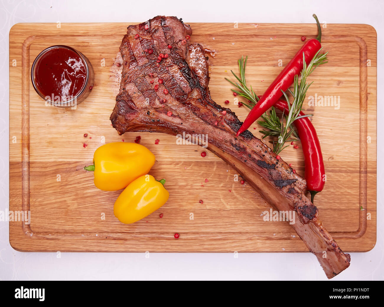 The Barbecue Tomahawk Steak on Cutting Board Stock Photo