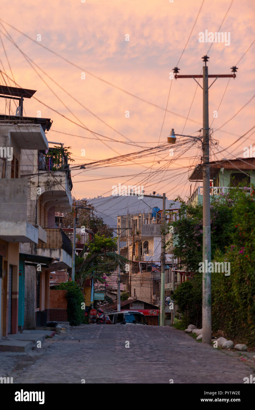 PANAJACHEL, GUATEMALA - MAY 21, 2018: Empty street at sunrise in the tourist town of Panajachel, Guatemala. Stock Photo