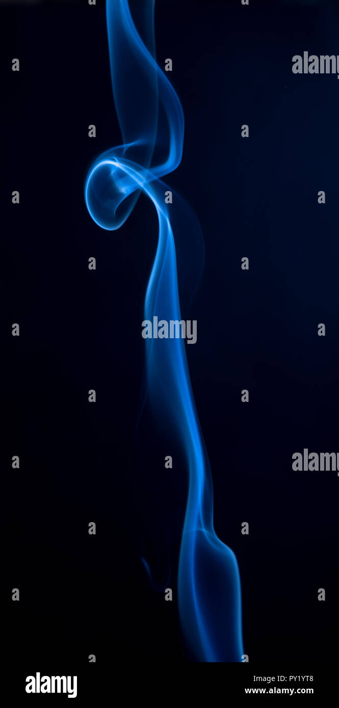 Abstract blue smoke swirls on dark background Stock Photo - Alamy