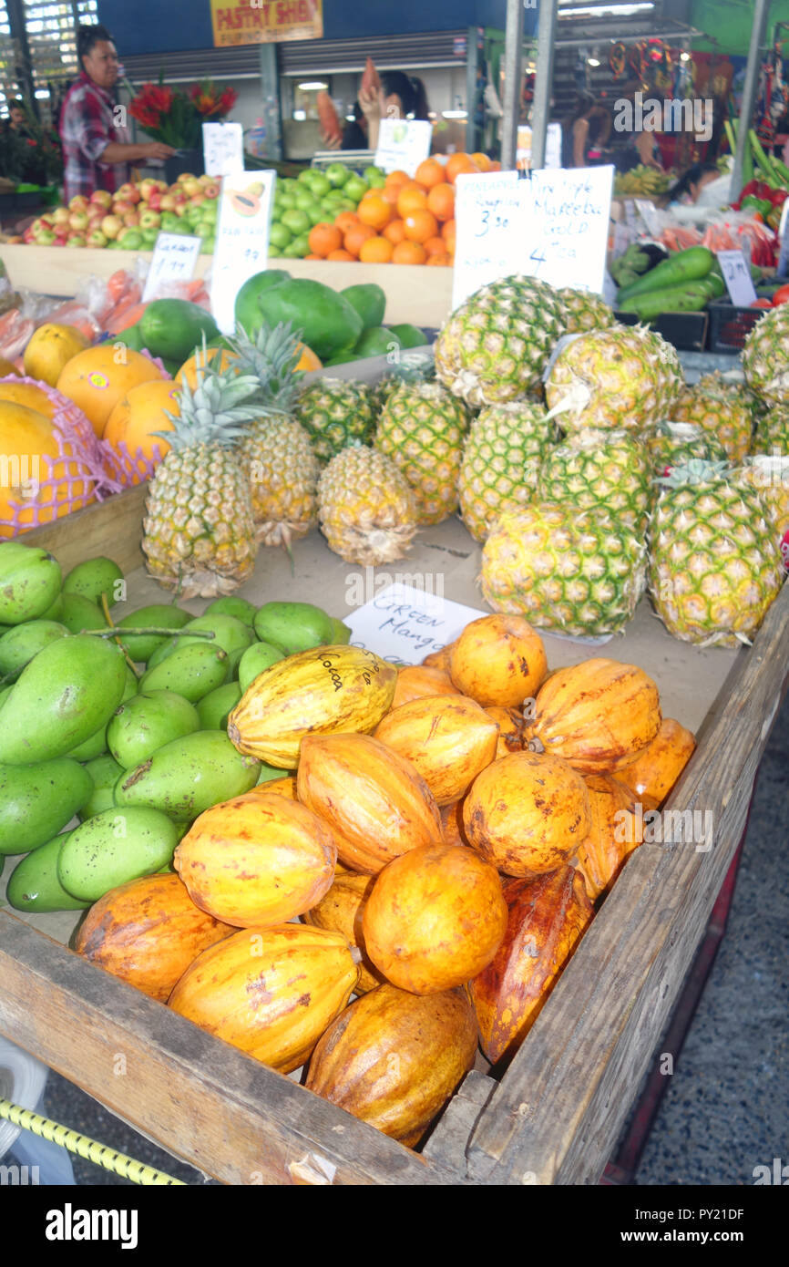 Cocoa pods (Theobroma cacao) amongst other tropical fruits at Rusty's Markets, Cairns, Queensland, Australia. No MR or PR Stock Photo