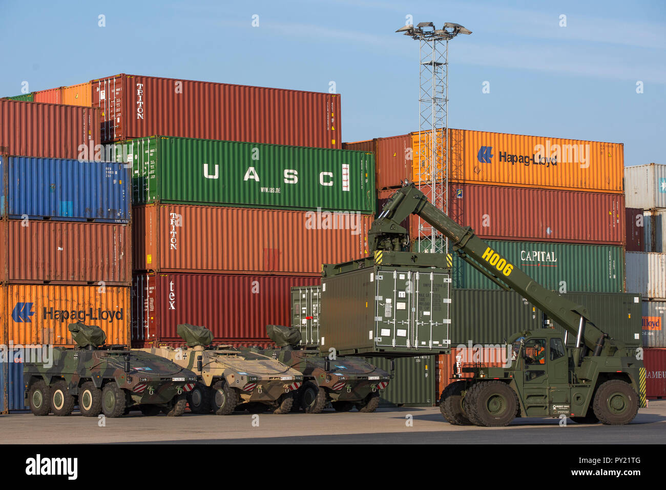 German armored transport vehicles Boxer-type are parked in the harbor area of Fredrikstad after the unloading process. A container handler 'Orion' by container transshipment. NATO exercise Trident Juncture in Norway, Fredrikstad on 11.10.2018.    Photo by Marco Dorow Stock Photo