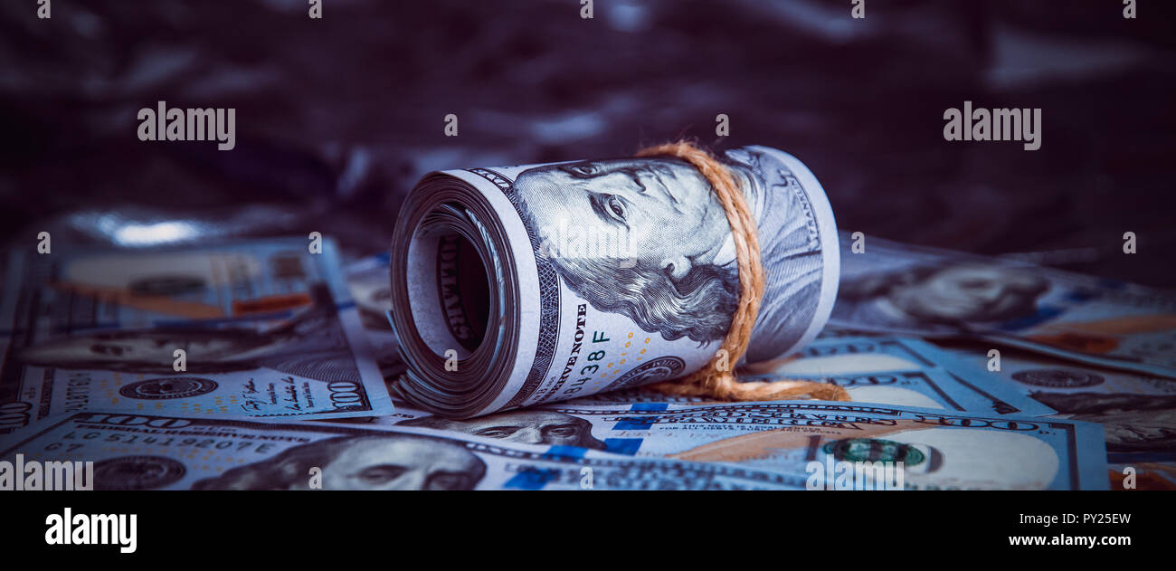 Tree On Money Stock Photos Tree On Money Stock Images Page 3 Alamy - in the dark on broken money is a roll of dollars stock image