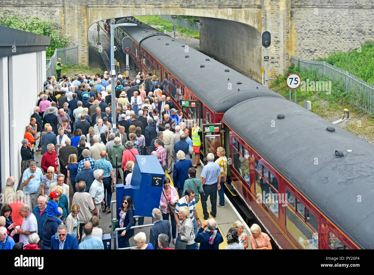 Aerial view looking down on crowd of people Oxford Parkway station platform hoping to see historic Flying Scotsman  steam locomotive engine England UK Stock Photo