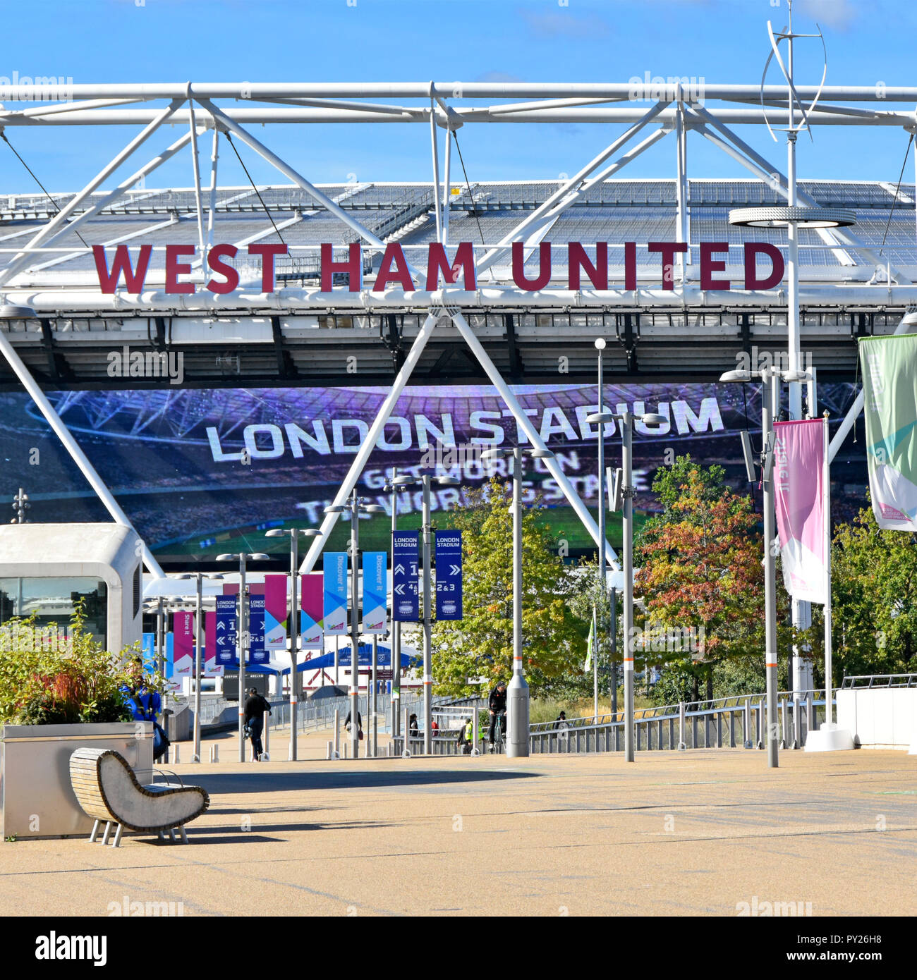 Advert sign for London Stadium on giant outdoor television screen below West Ham United sign Olympic stadium Queen Elizabeth Olympic park England UK Stock Photo