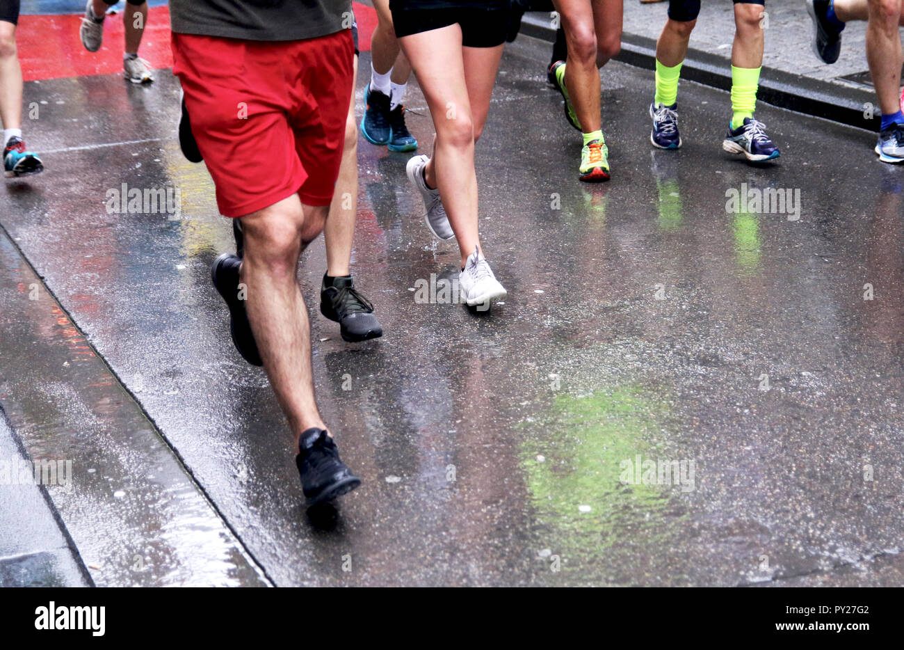 Runners racing on a rainy day Stock Photo