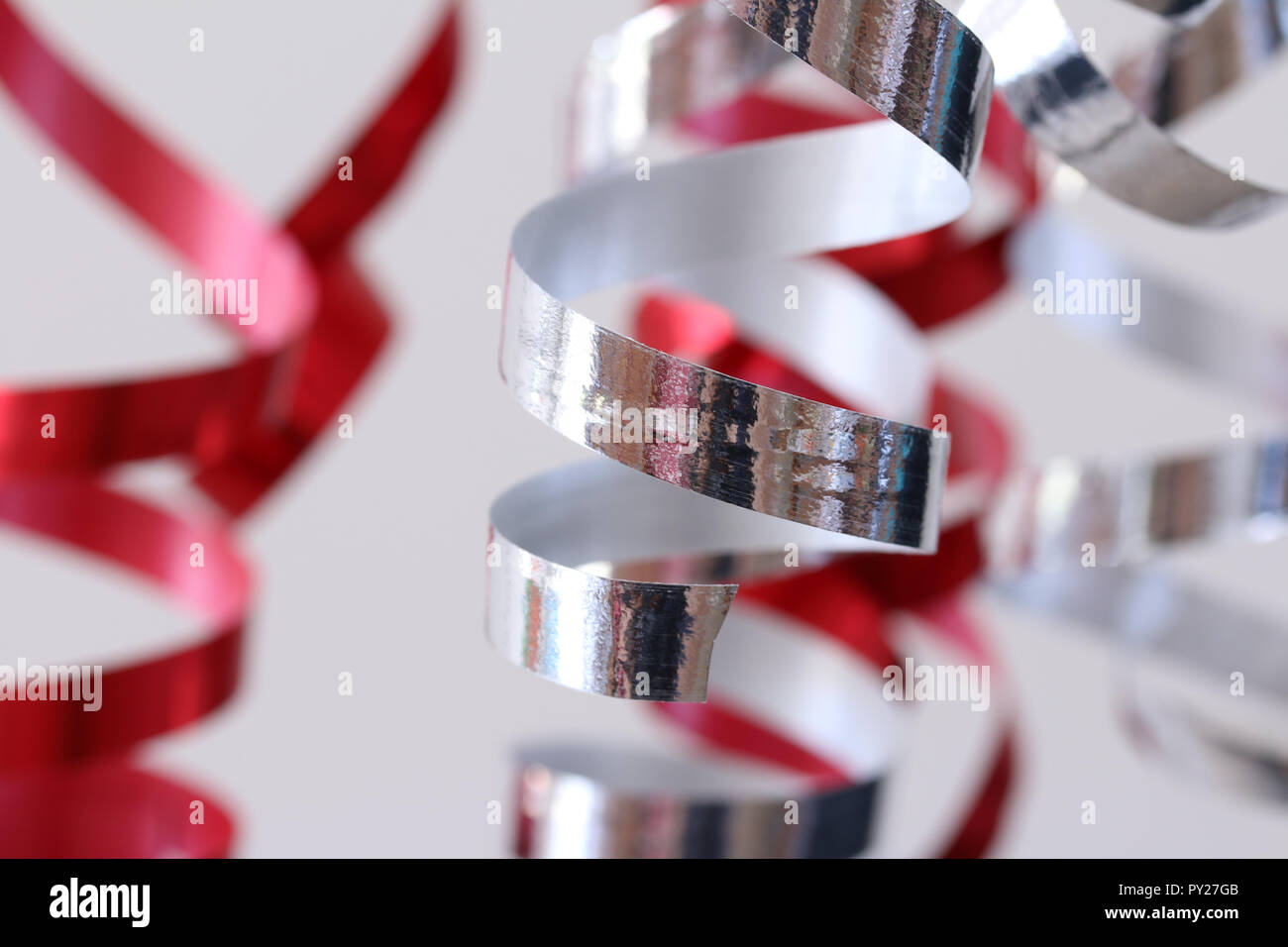 Red and silver streamers party decoration Stock Photo