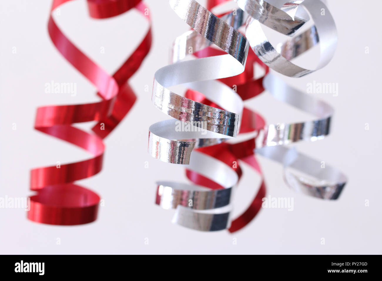 Red and silver streamers party decoration Stock Photo
