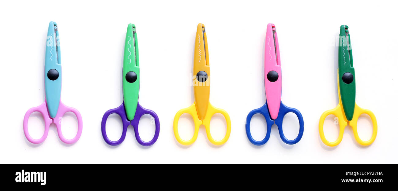 Five colorful children's scissors or shears isolated on white Stock Photo