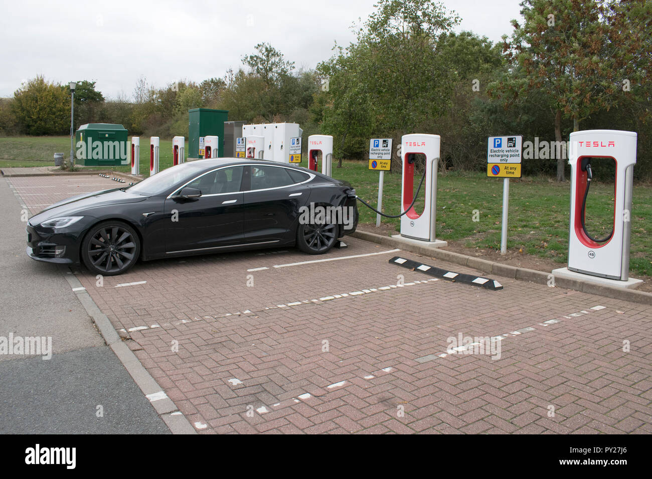 Motorway service station charging for Tesla electric cars Stock Photo ...