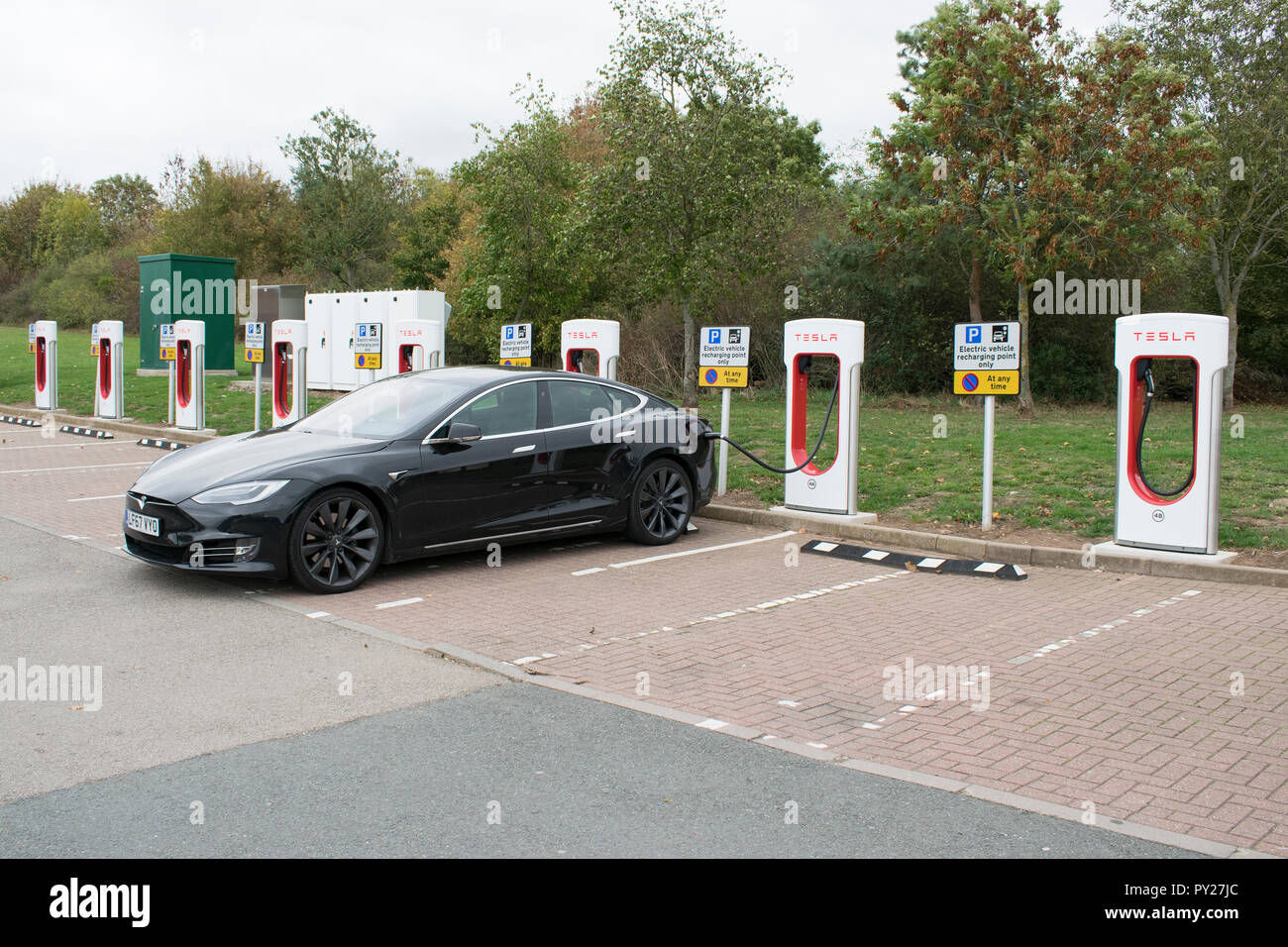 Motorway service station charging for Tesla electric cars Stock Photo ...
