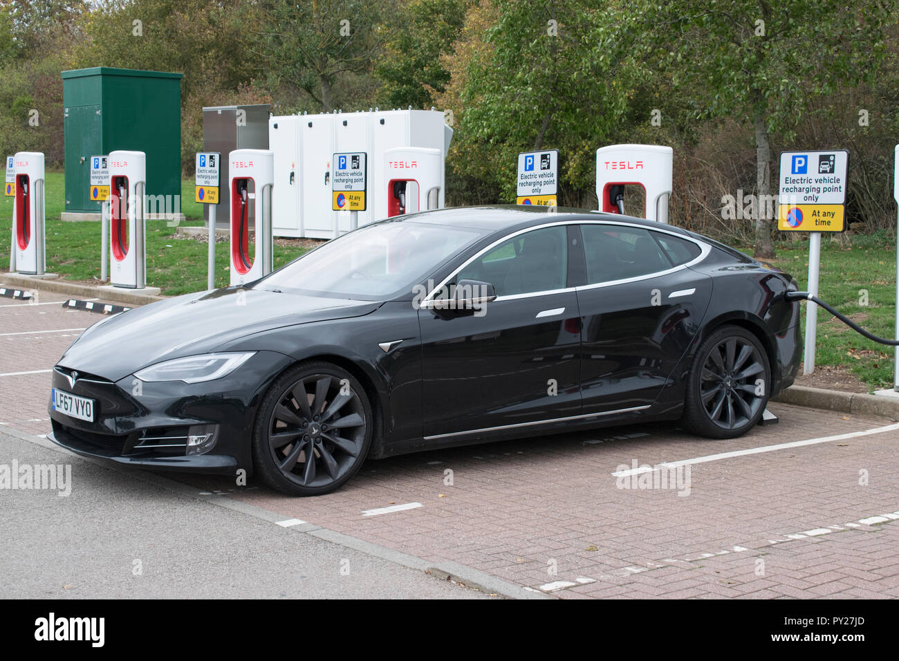 Tesla car charging point motorway hi-res stock photography and images ...
