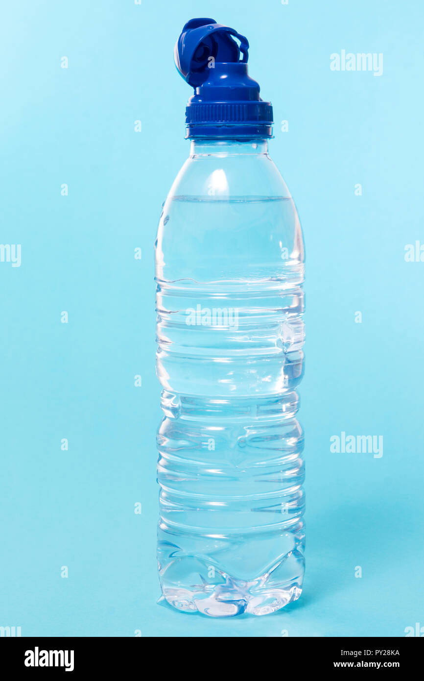 plastic water bottle over a blue background Stock Photo Alamy