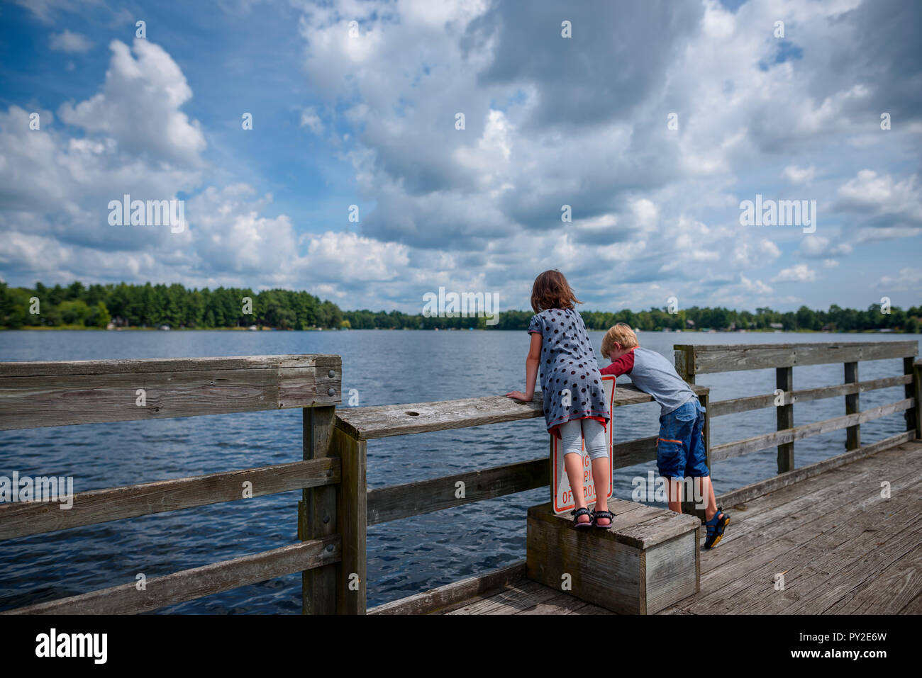 Two boys fishing at dock hi-res stock photography and images - Alamy