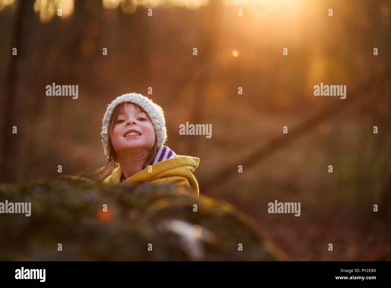 Portrait of a smiling girl in the woods at sunset, United States Stock ...