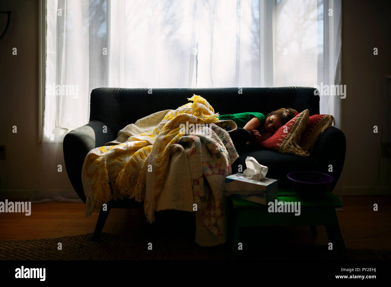 Girl sleeping on a couch Stock Photo Alamy