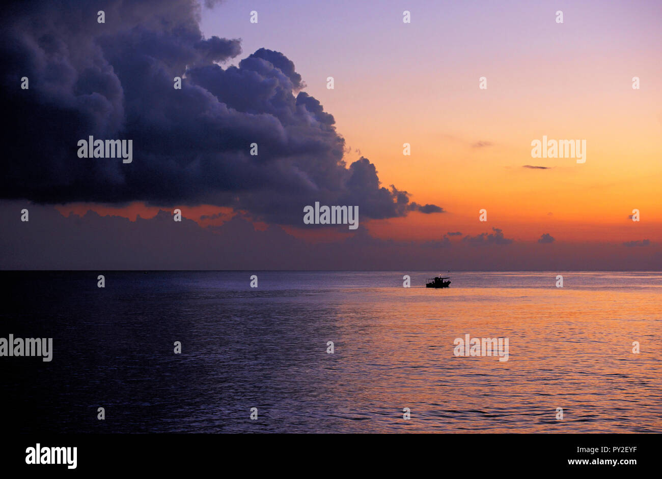 Silhouette of a boat at sea at sunset, Valletta, Malta Stock Photo - Alamy