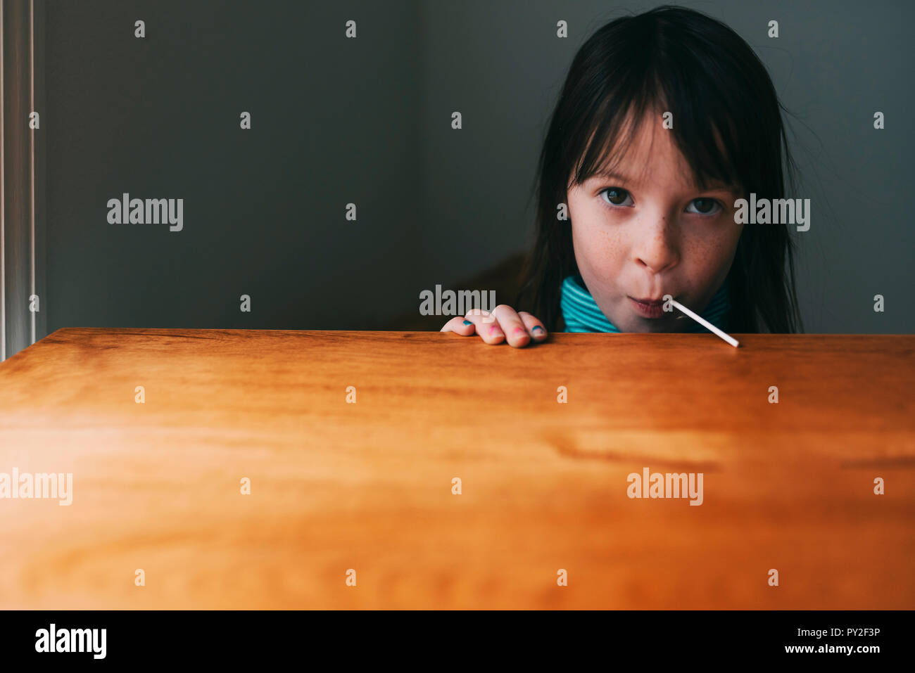 Portrait of a girl eating a lollipop Stock Photo