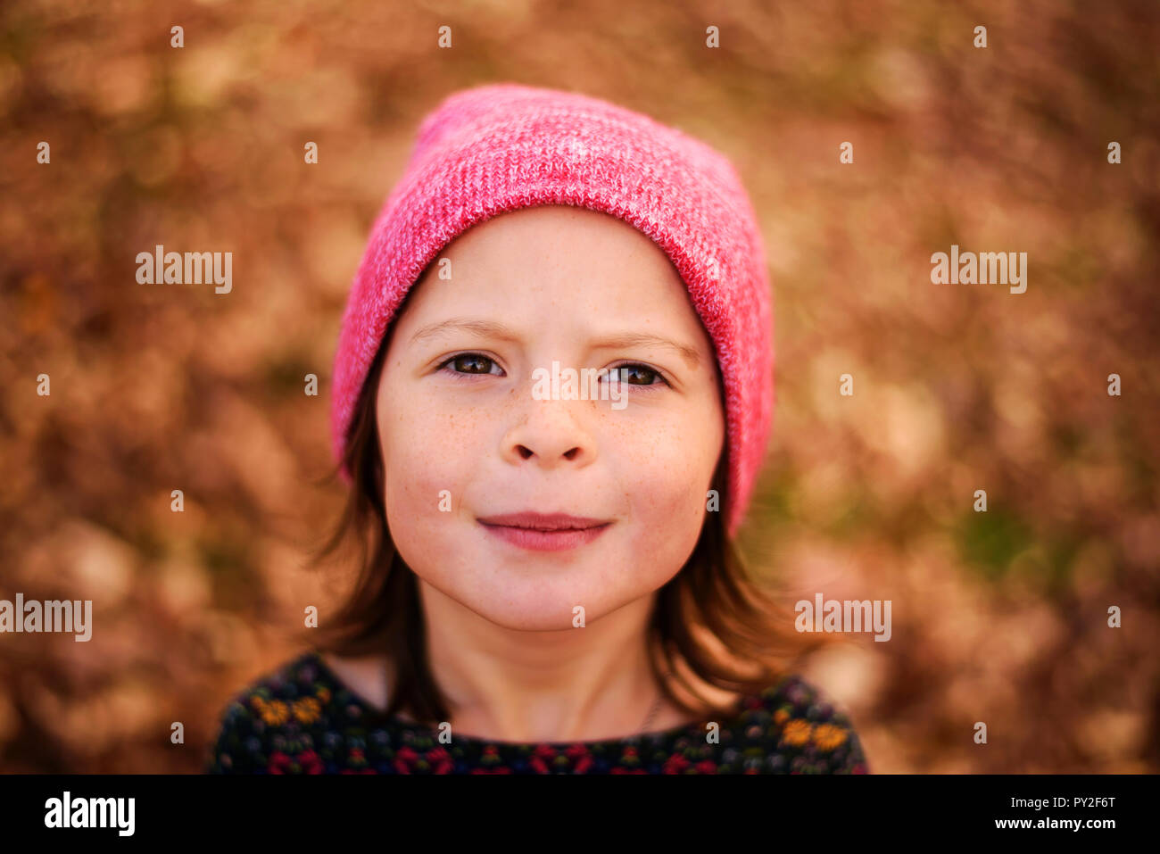 Portrait of a smiling girl standing outdoors, United States Stock Photo