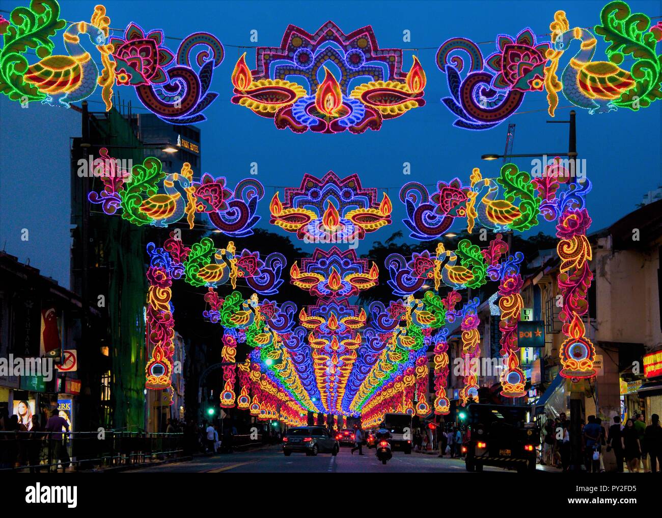 Colourful street lights and decorations celebrating Diwali or Deepavali festival of lights in Little India, Singapore during blue hour Stock Photo