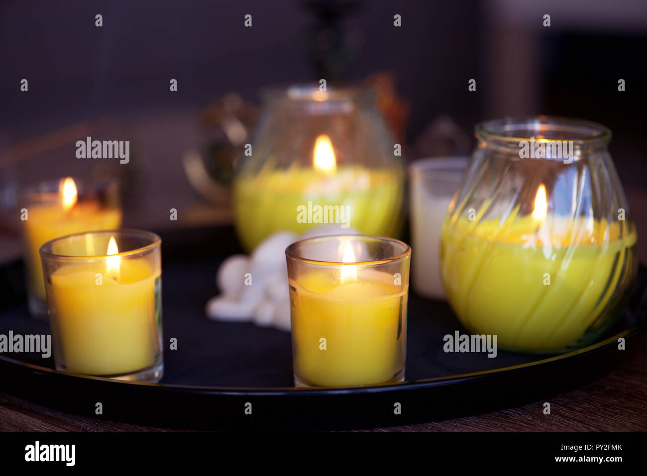 Lit candles on a tray Stock Photo Alamy