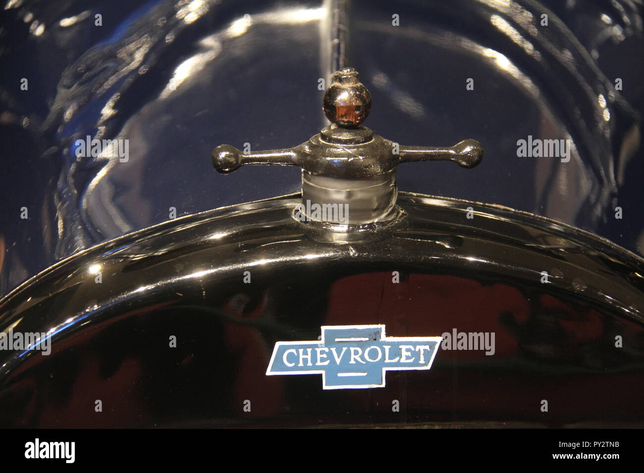 Logo and ornament of antique Chevrolet on display at The Car and